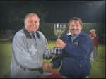 Team Captain Tapper Thomas collects the Champagne Cup from Dave Card..